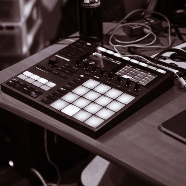 Grayscale shot drum pad machine beats sound design wooden table 600x600